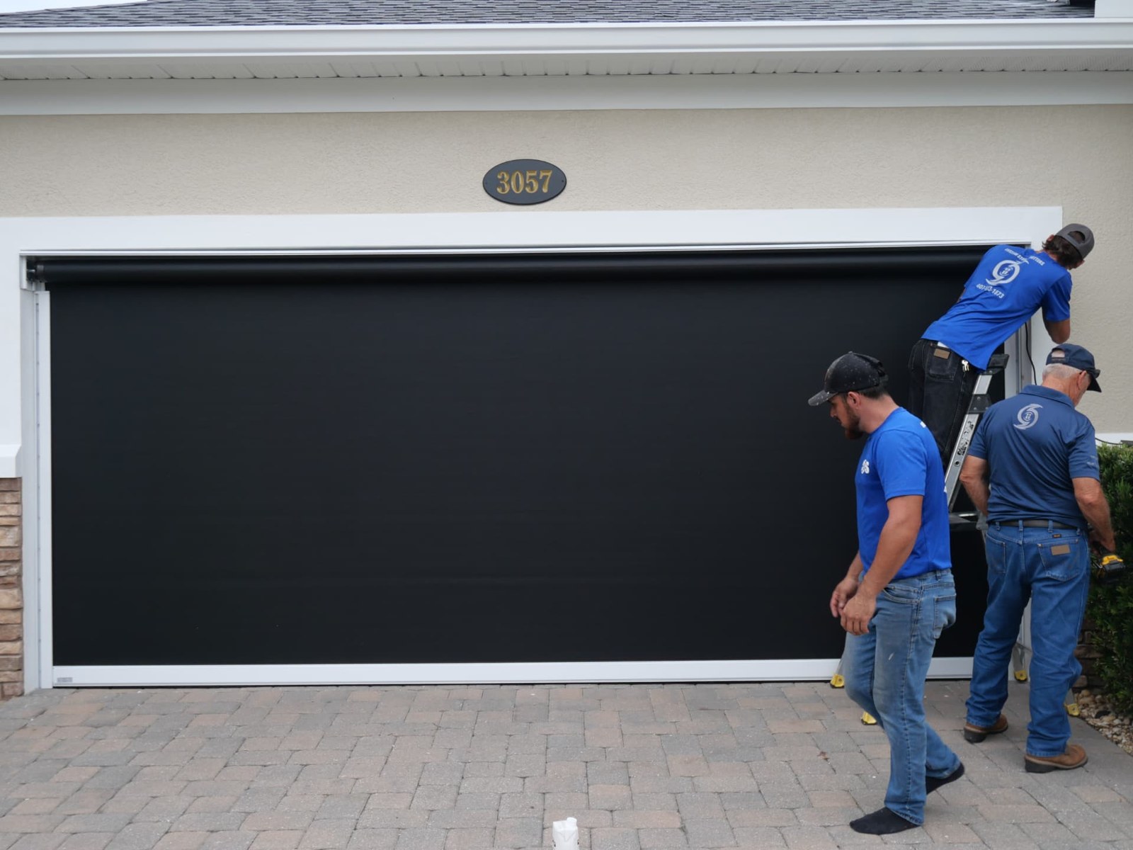 Our team fitting the screen and side tracks