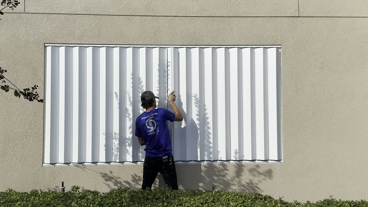 White accordion shutter — still from our operation video